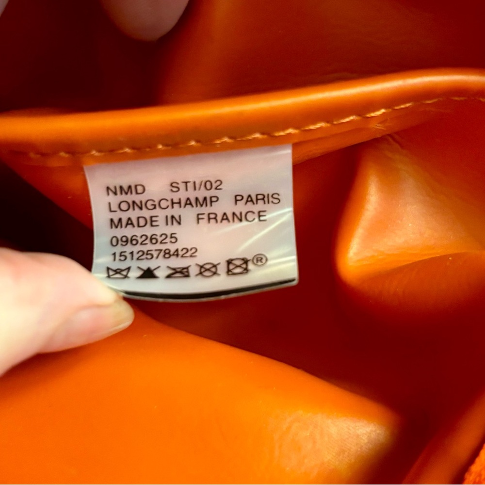 Coral/orange with detachable strap. VERY good condition. - Picture 2 of 5